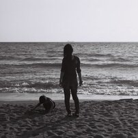 Parent and child on the sand