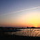 夕日とひこうき雲