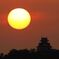 夕日が城に