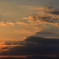 The setting sun illuminates the ship