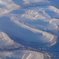 「飛行機」丸窓から見る・ロシア 雪山