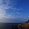 青い海と青い空、白い雲と白い灯台