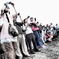 Masses of people.