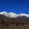 青空に生える晩秋の白馬三山