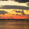 夕暮れの岬と海堡と漁の海