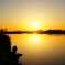 Rising sun and anglers