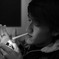 The man lights up a cigarette