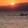 伊豆半島の夕陽とイカ釣り船