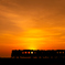 車窓の先の夕陽