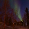 A cottage with northern lights 