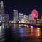 横浜夜景。ランドマークタワー、観覧車、船。万国橋から撮影。