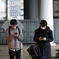 Two men with his phone