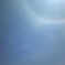 飛行機雲と太陽の輪