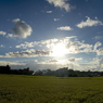 夕日前の空と田畑