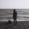 Parent and child on the sand