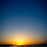 飛行機雲と夕焼け
