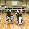 Two people smiling at the tournament.
