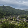 白川郷の新緑（雪残りの山並み）