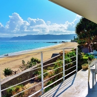 a balcony overlooking the vivid blue... 