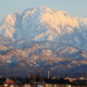 夕日に照らされる立山連峰剱岳