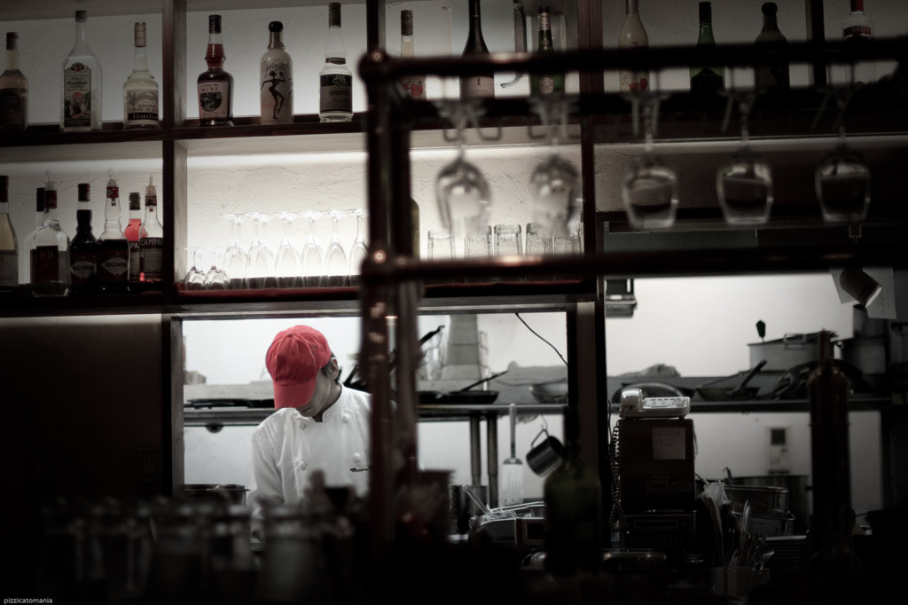 A cook with a red cap