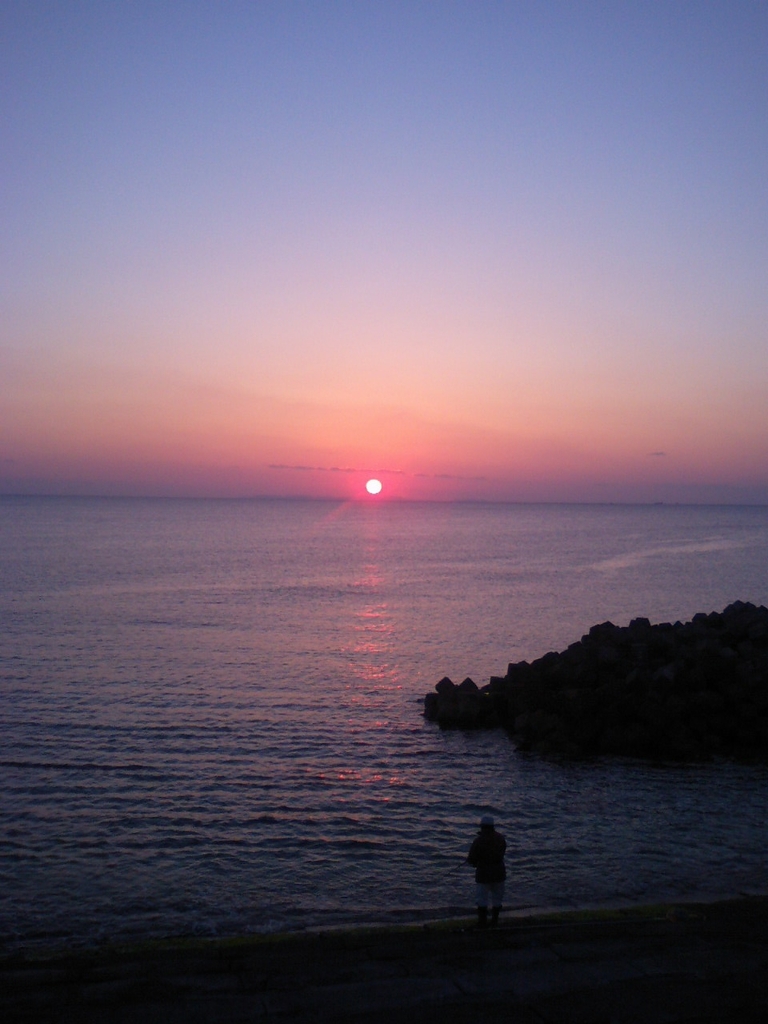 夕日と釣人