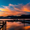 湖菖蒲ヶ浜から見た日の出前の朝焼けに染まる中禅寺湖