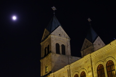a church with the bright moon