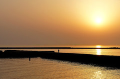 黄砂と夕日