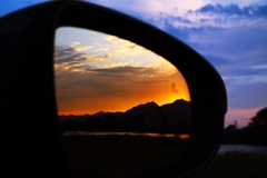 Sunset reflected in the side mirror