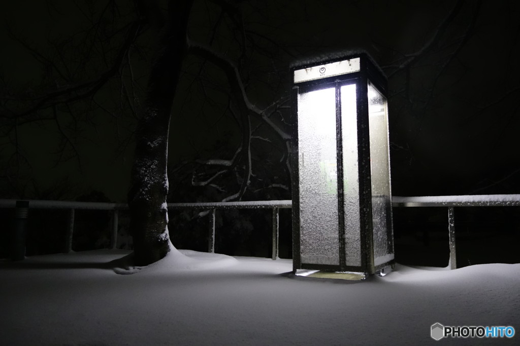 Telephone booth on snowy day