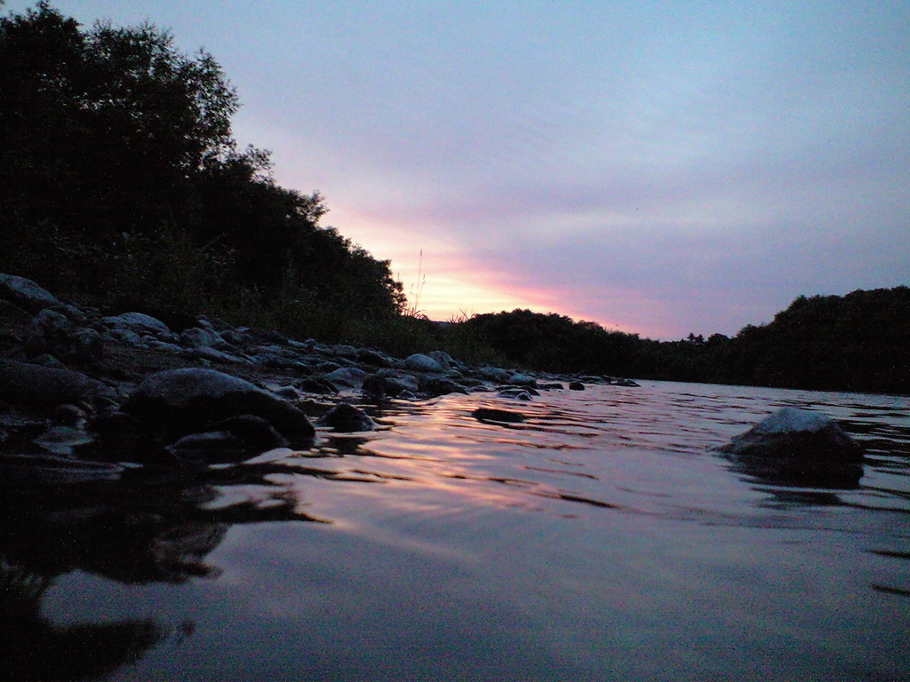 The setting sun which flows