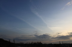 夕日と飛行機雲