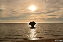 奇岩と東シナ海に沈む太陽