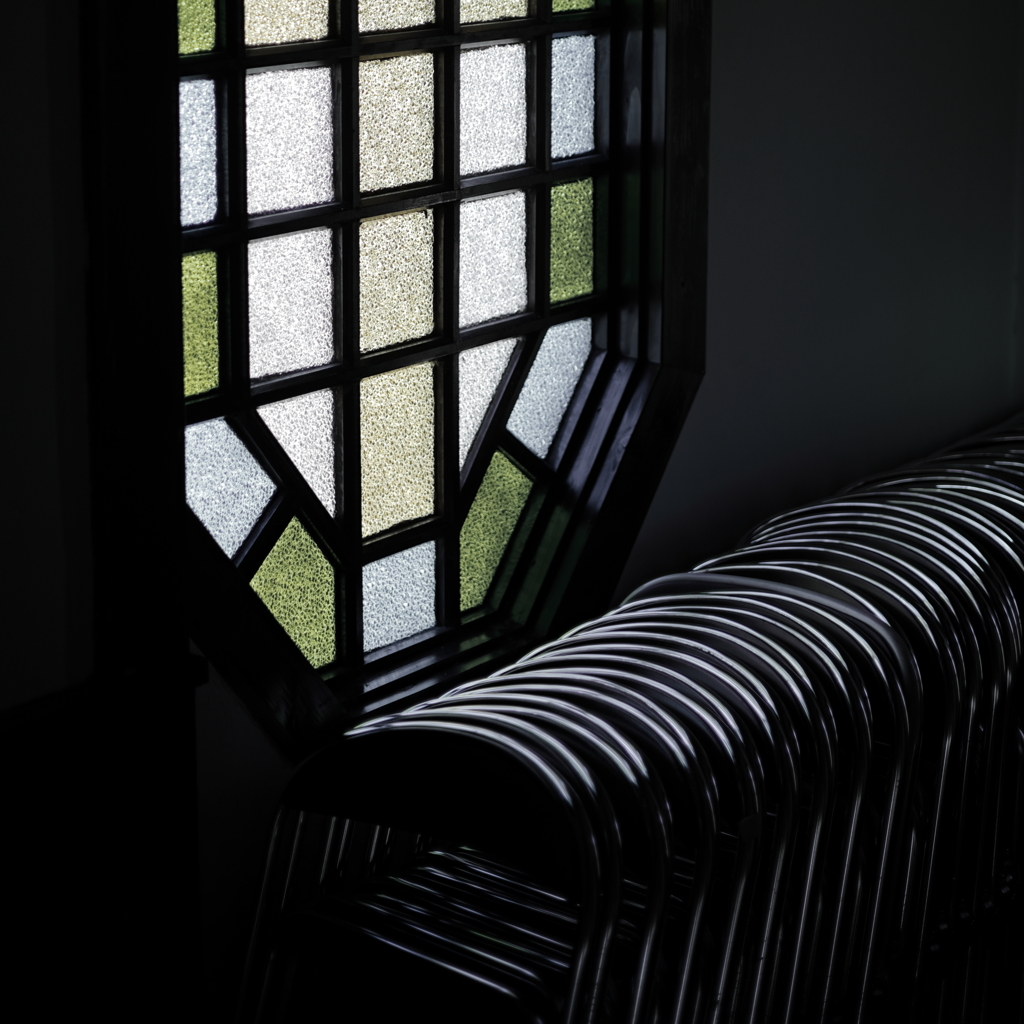 Stained glass and folding chair