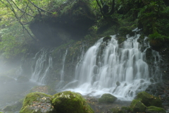 waterfall surrounded by fog