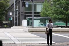 A woman is waiting for a signal