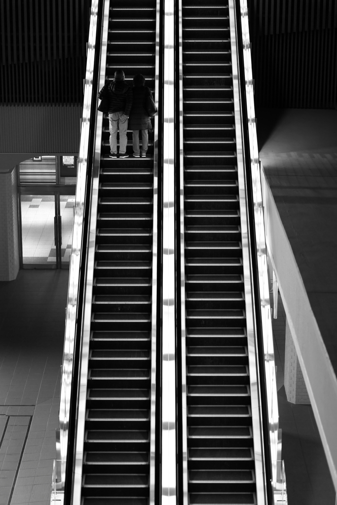At the escalator