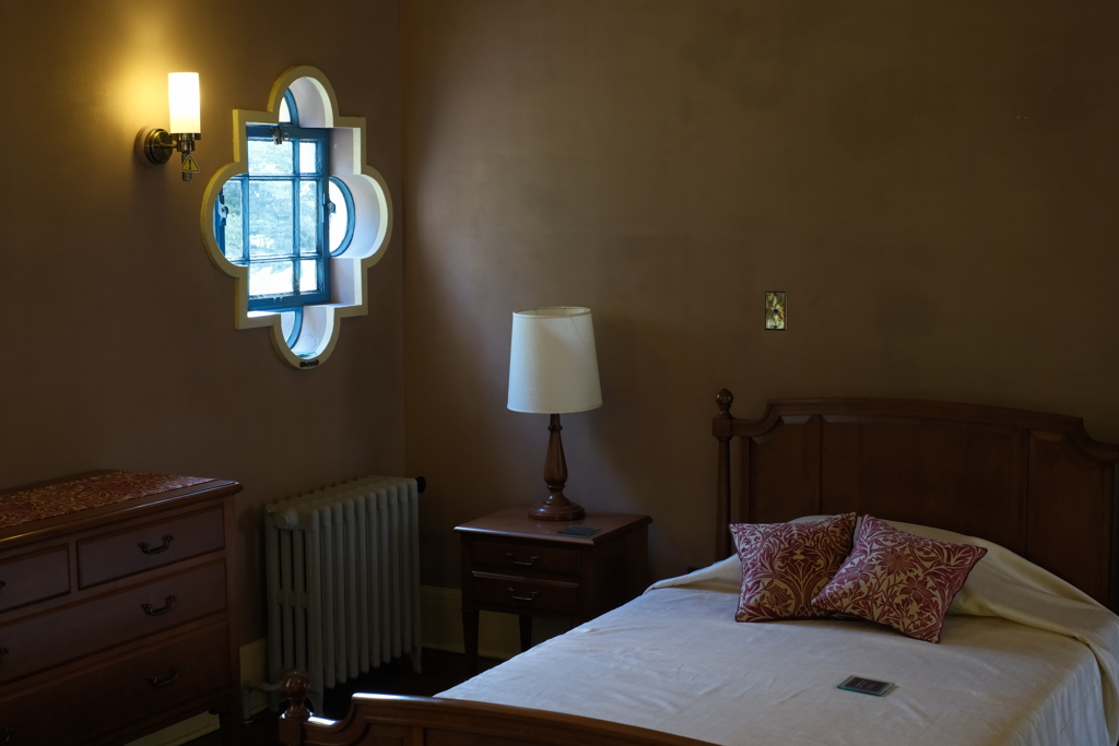 Quatrefoil small window in bedroom