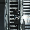 two people on an escalator