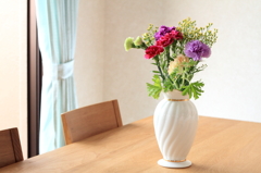 A dining table with flowers