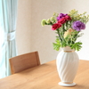 A dining table with flowers