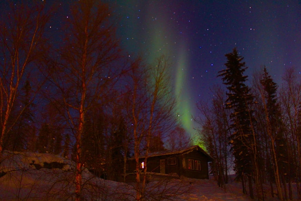 A cottage with northern lights 