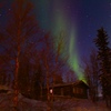 A cottage with northern lights 