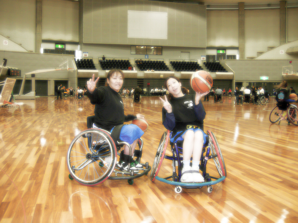 Two people smiling at the tournament.