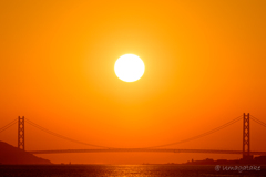 The sun over the Akashi Bridge