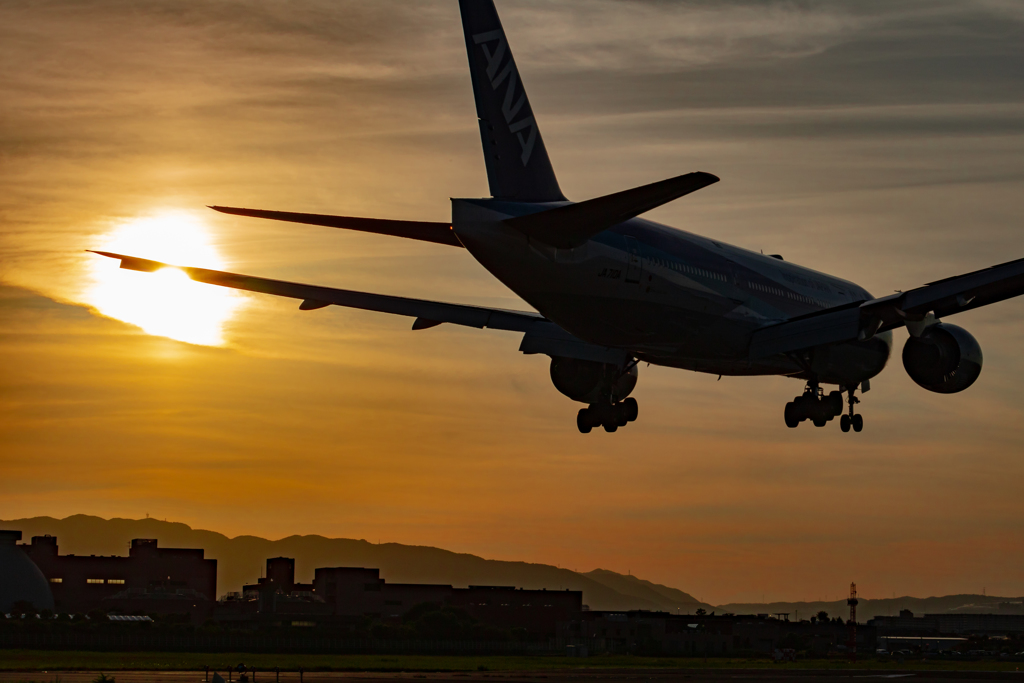 Silhouette of the plane at sunset