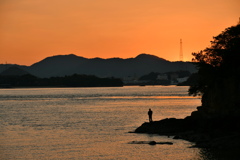 釣り人と夕景