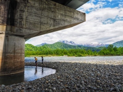 By the river