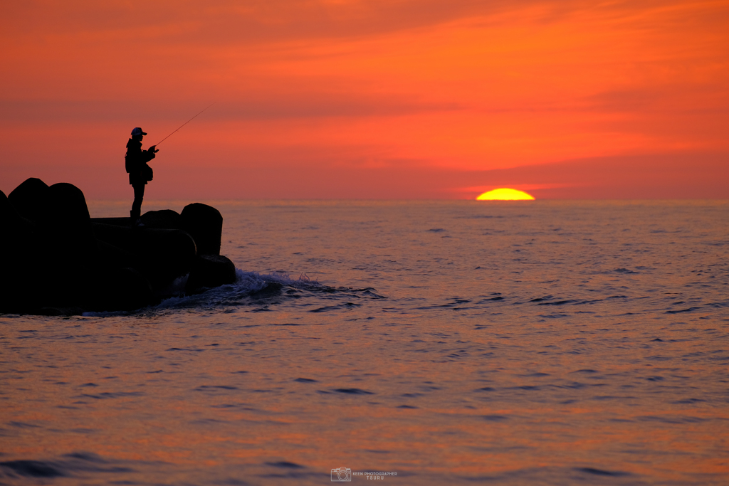 釣り人と夕日